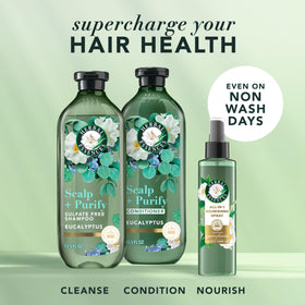 Herbal Essences bottles in hand for scale illustrating travel-friendly sizes