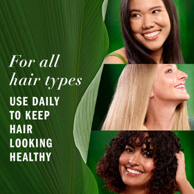 Hand holding 3.2 fl oz bottle to show size and portability of Herbal Essences oil