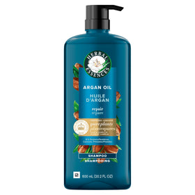 Herbal Essences bottle next to a hand for scale to show generous 20.2 fl oz size