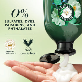 Herbal Essences spray mist in mid-air delivering instant frizz control