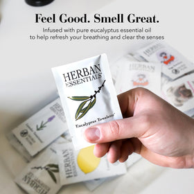 Herban Essentials eucalyptus wipes inside a purse, lifestyle freshness on the go