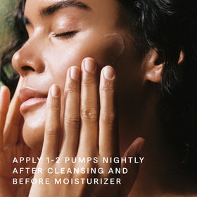 HERBIVORE serum next to moisturizer in nighttime skincare setting for routine