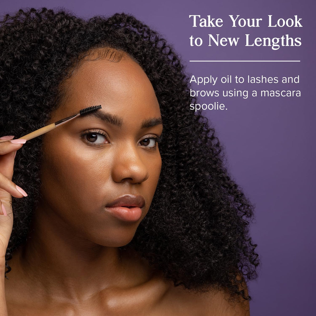 HERITAGE STORE applying oil to hair ends for shine and hydration