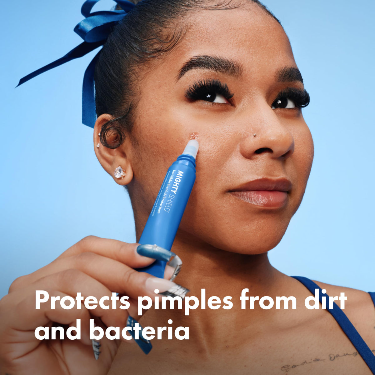 HERO COSMETICS dropper dispensing clear Mighty Shield liquid to show texture