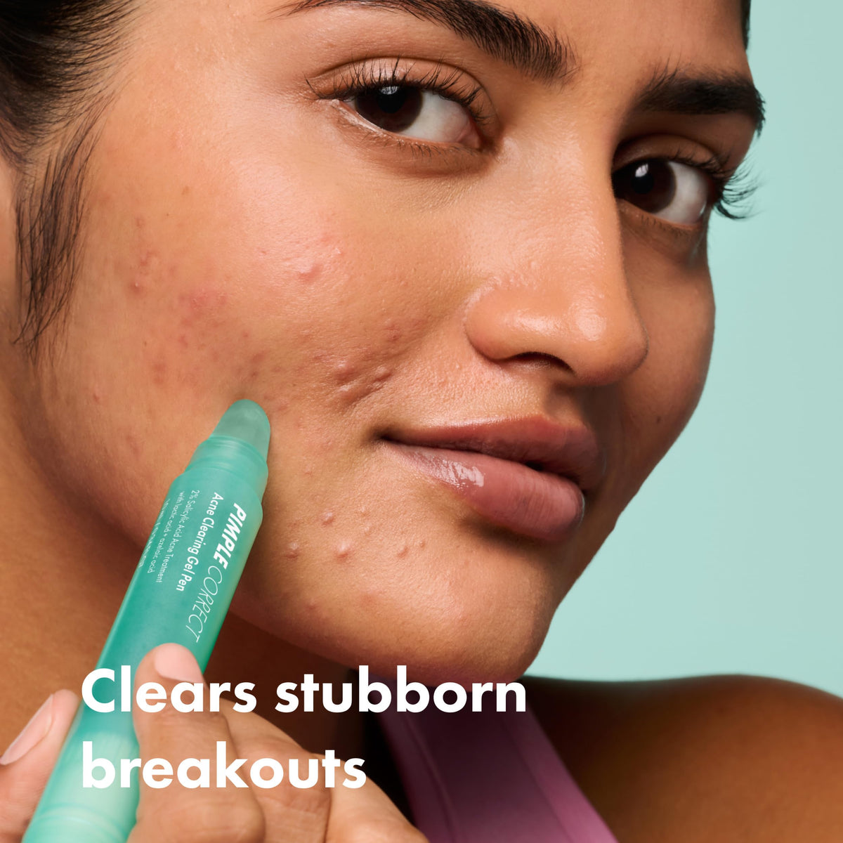 Hero Cosmetics pen in hand demonstrating easy twist-and-apply benefit