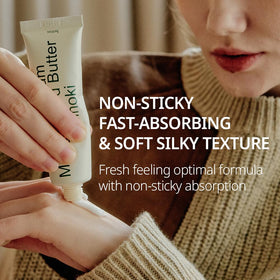hetras applying cream to hands demonstrating non-greasy, smooth finish