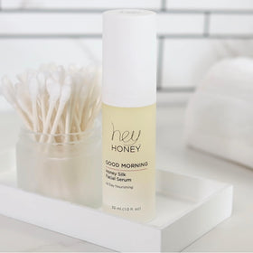 Hey Honey bottle on bathroom vanity styled to show lifestyle-ready morning routine