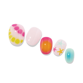 heyhae lifestyle shot at beach showing vibrant manicure matching coastal vibe benefit