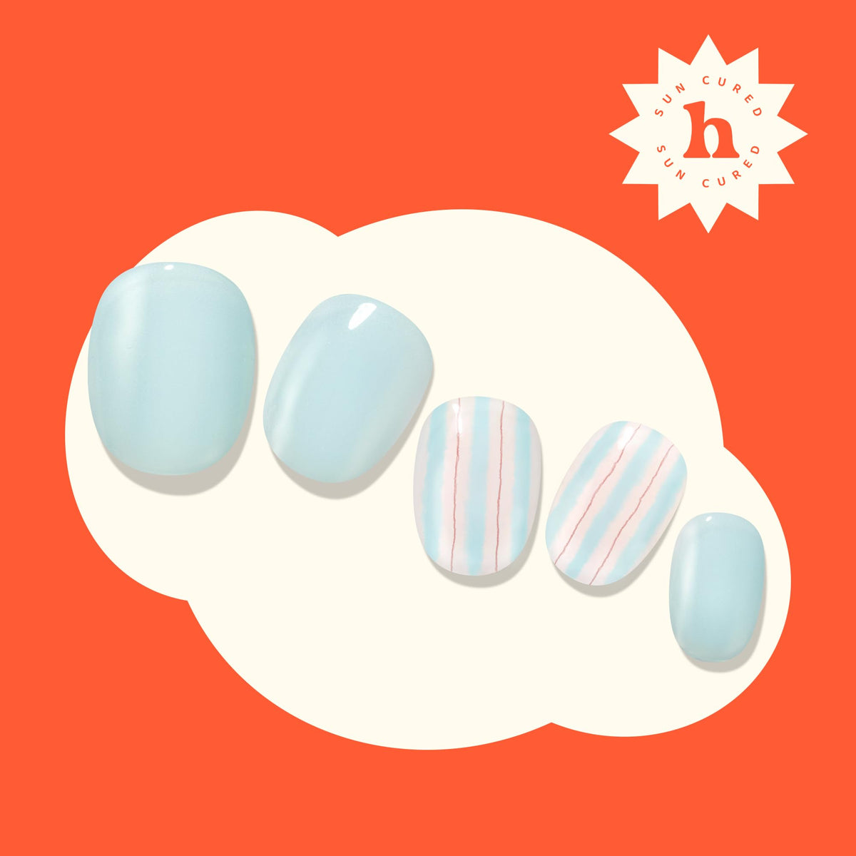 heyhae on hand lifestyle shot wearing pastel blue striped nails for playful style