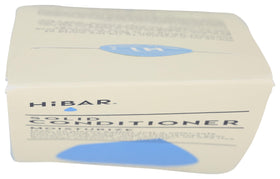 HiBAR bar held in hand for scale showing compact, travel-friendly solid conditioner benefit