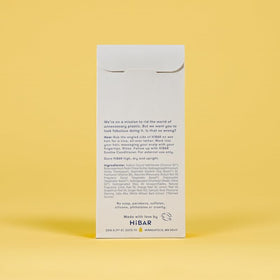 HIBAR shampoo bar on bathroom shelf in lifestyle setting promoting sustainable care