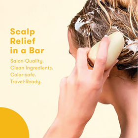 HIBAR shampoo bar in hand creating lather for easy application