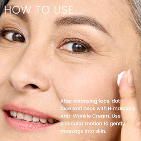 Himalaya applying cream to mature skin reducing fine lines