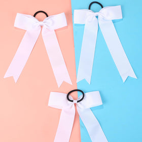 Hipcheer cheer bow attached to ponytail demonstrating secure wrapped elastic for active movement