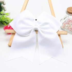 Hipcheer bow worn on a ponytail demonstrates visible sideline style and comfort