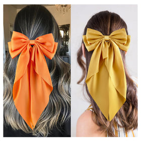 hisial bow clipped in ponytail, illustrates styling effect and instant elegance benefit