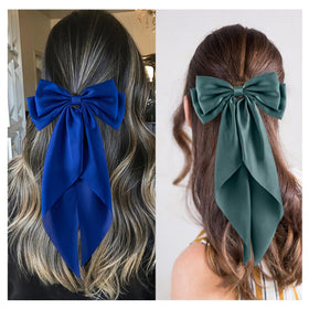 hisial bow clipped in a high ponytail demonstrating lift and polished style