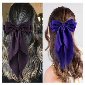 hisial bow clipped in ponytail showing polished style and easy use