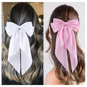 hisial bow clipped into a ponytail showing elegant styling and polished everyday look