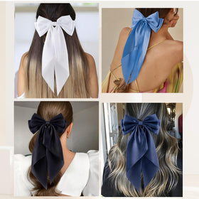 hisial hand holding bow showing size and scale for styling choices