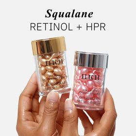 HKH capsule next to coin showing compact size and portability
