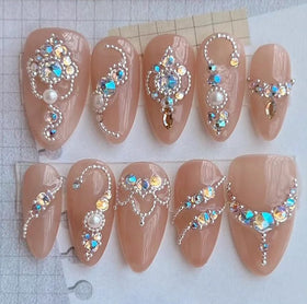HNUIX lifestyle manicure scene with beads adding luxury accents to nails