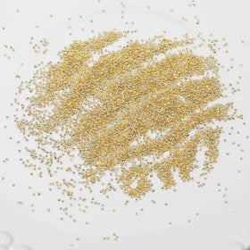 HNUIX scale comparison with coin to show bead sizes and selection clarity