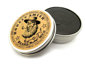 Honest Amish 2 oz jar beside ruler showing size and travel-friendly benefit