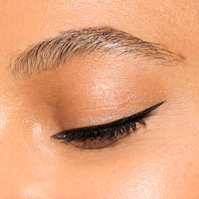 Honest Beauty applied winged eyeliner on model showing sharp, bold definition and longevity