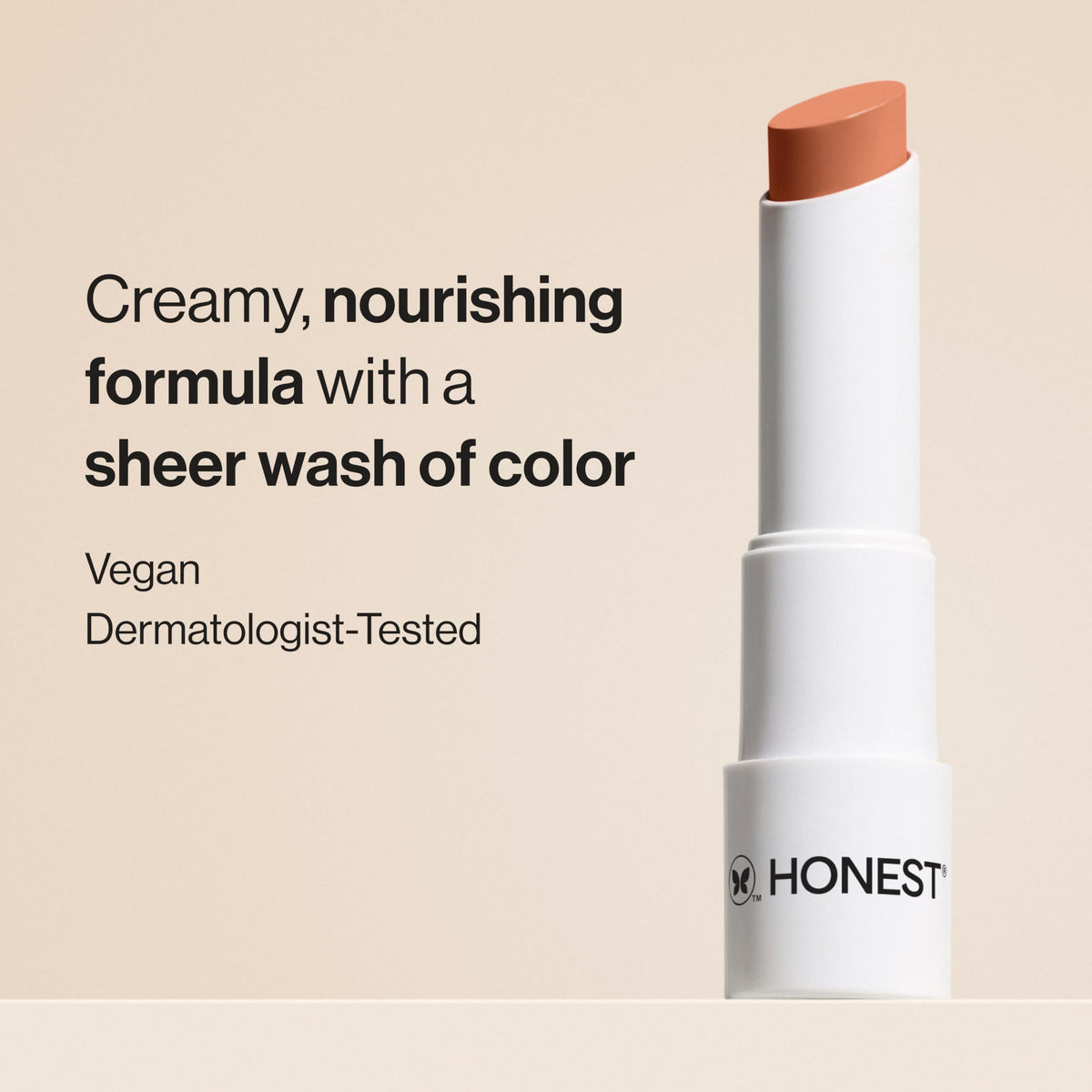 Honest Beauty open twist-up lip balm bullet revealing creamy tip for smooth application
