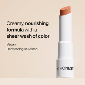 Honest Beauty open twist-up lip balm bullet revealing creamy tip for smooth application