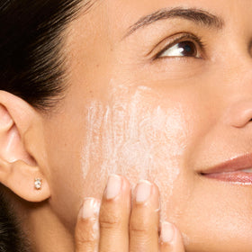Honest Beauty bottle styled on counter suggesting soothing daily ritual