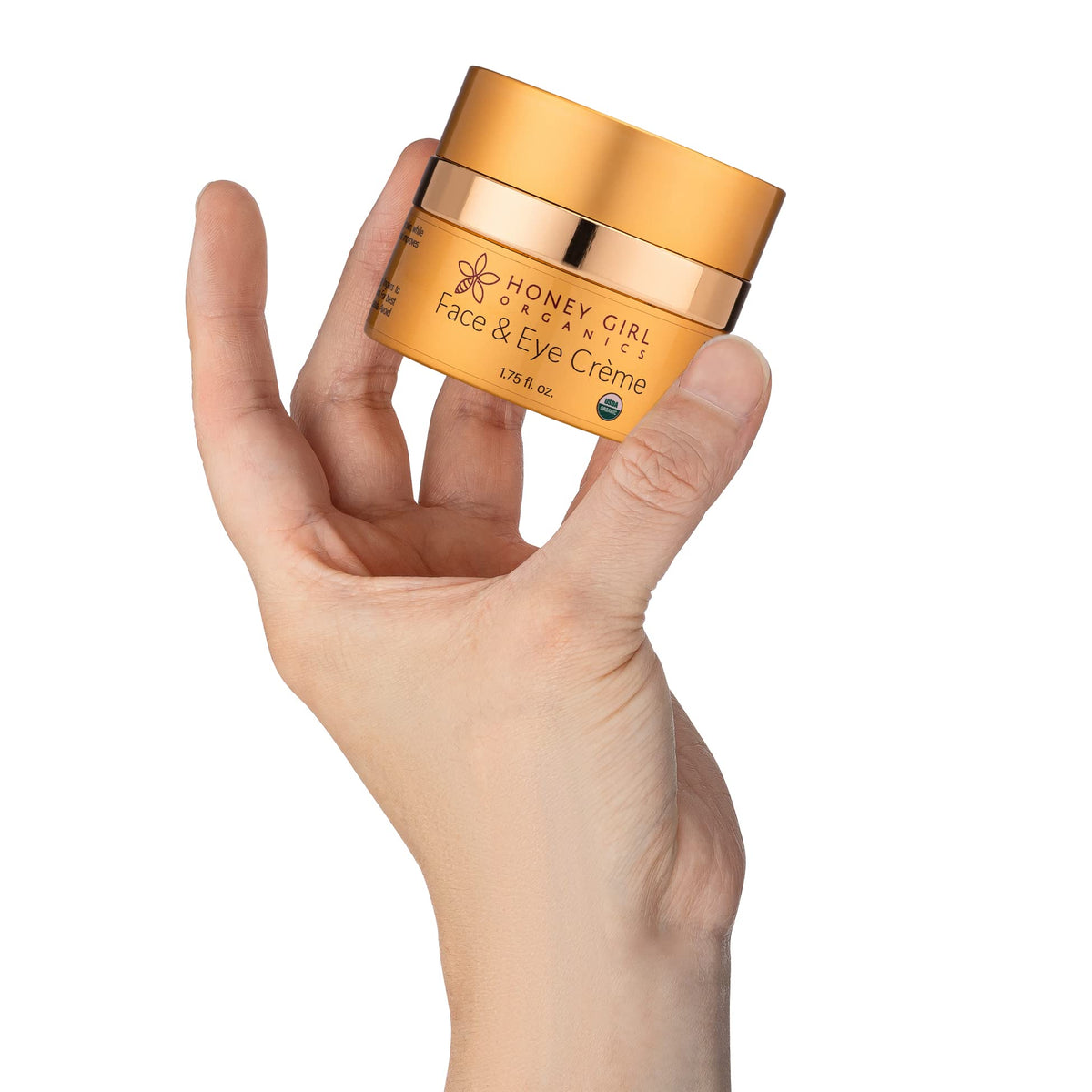 Honey Girl Organics texture close-up of cream on fingertip, demonstrating rich moisturizing feel