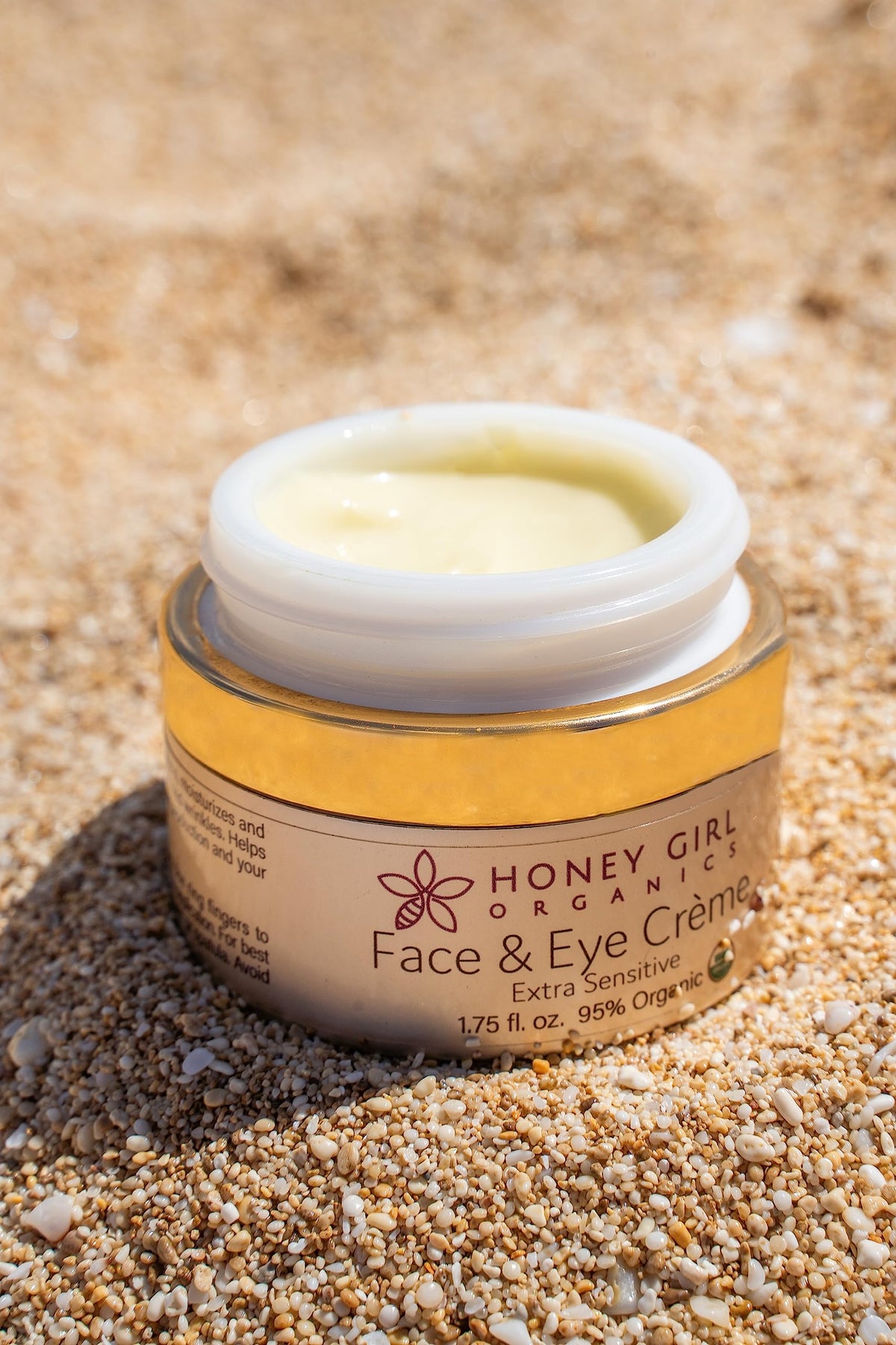 Honey Girl Organics jar on a bathroom vanity showing natural skincare for sensitive routines