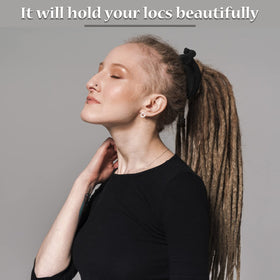 Outdoor portrait of person wearing Hoteam tie in styled dreadlocks for discreet look