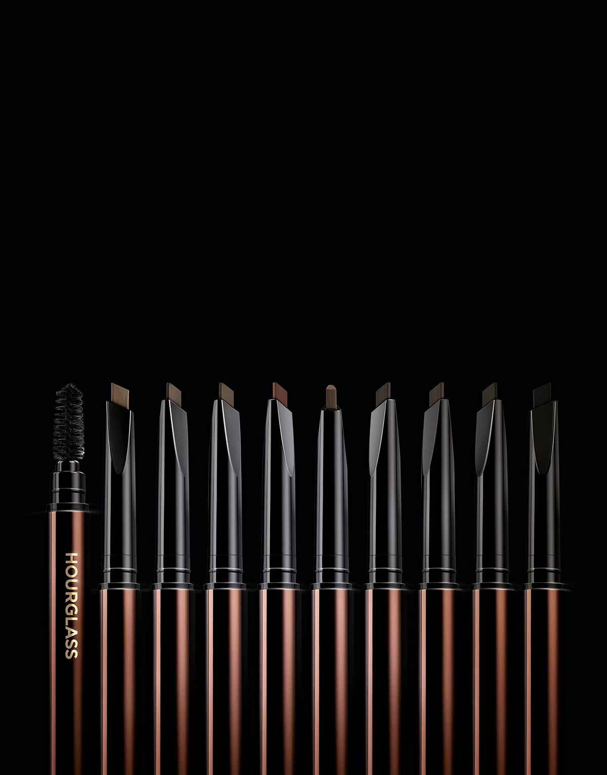 HOURGLASS pencil in use on a model demonstrating quick shaping and blended natural-looking blonde brows