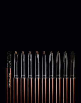 HOURGLASS pencil in use on a model demonstrating quick shaping and blended natural-looking blonde brows