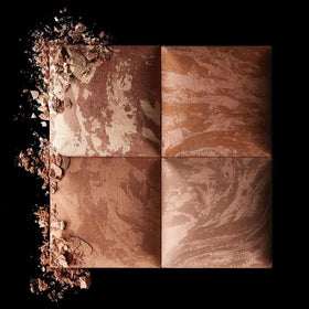 HOURGLASS bronzer in a makeup bag beside a mirror illustrating travel-ready application benefit