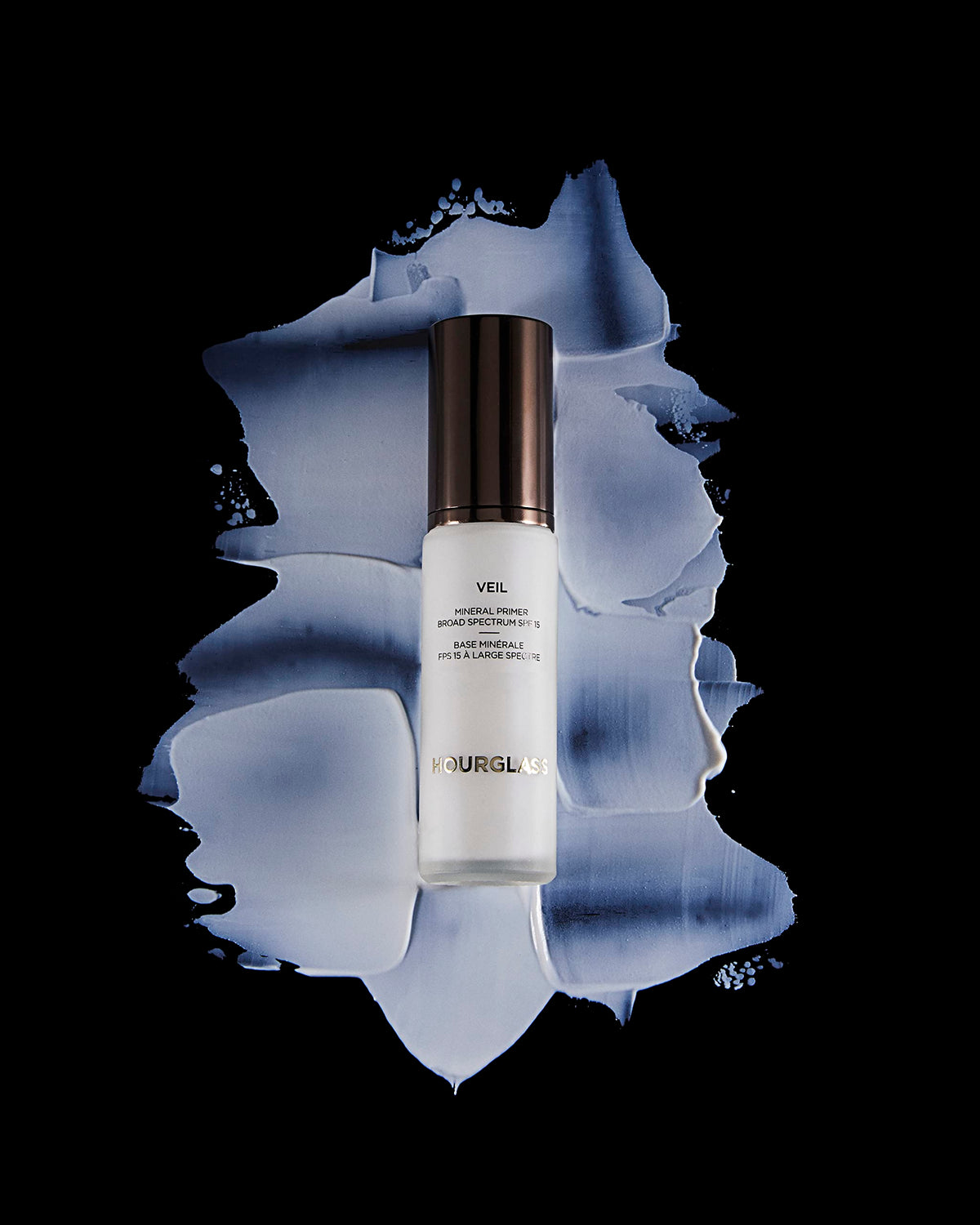 HOURGLASS primer applied on model face demonstrating smoother pores and longer makeup hold
