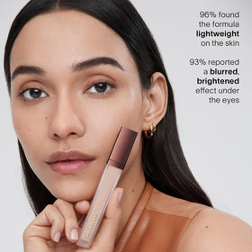 HOURGLASS concealer inside a makeup bag lifestyle shot for on-the-go wear