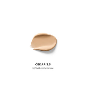HOURGLASS concealer wand applicator demonstrating precise spot application