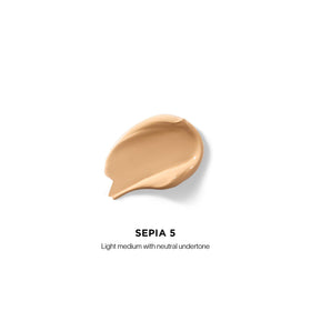 HOURGLASS concealer wand applicator demonstrating precise, clean application
