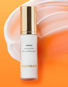 HOURGLASS Vanish primer swatched on hand demonstrating blendability and pore-blurring effect