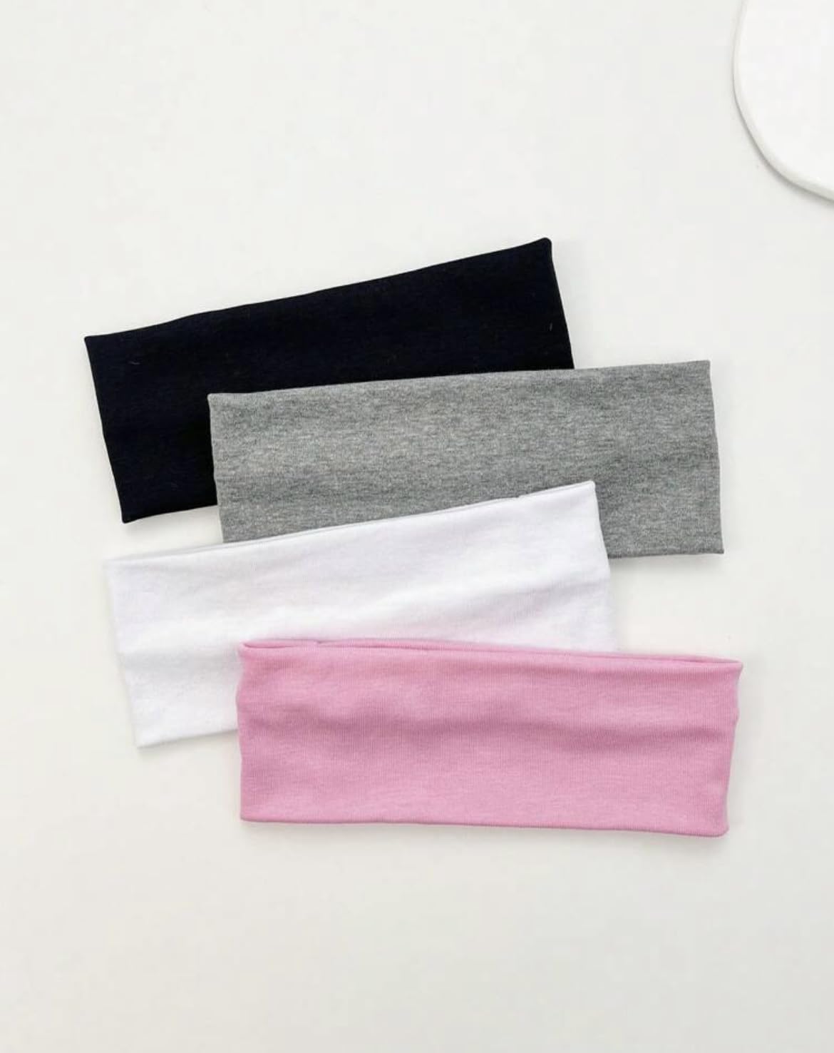 Huachi flat lay color range showing black white light and dark gray options