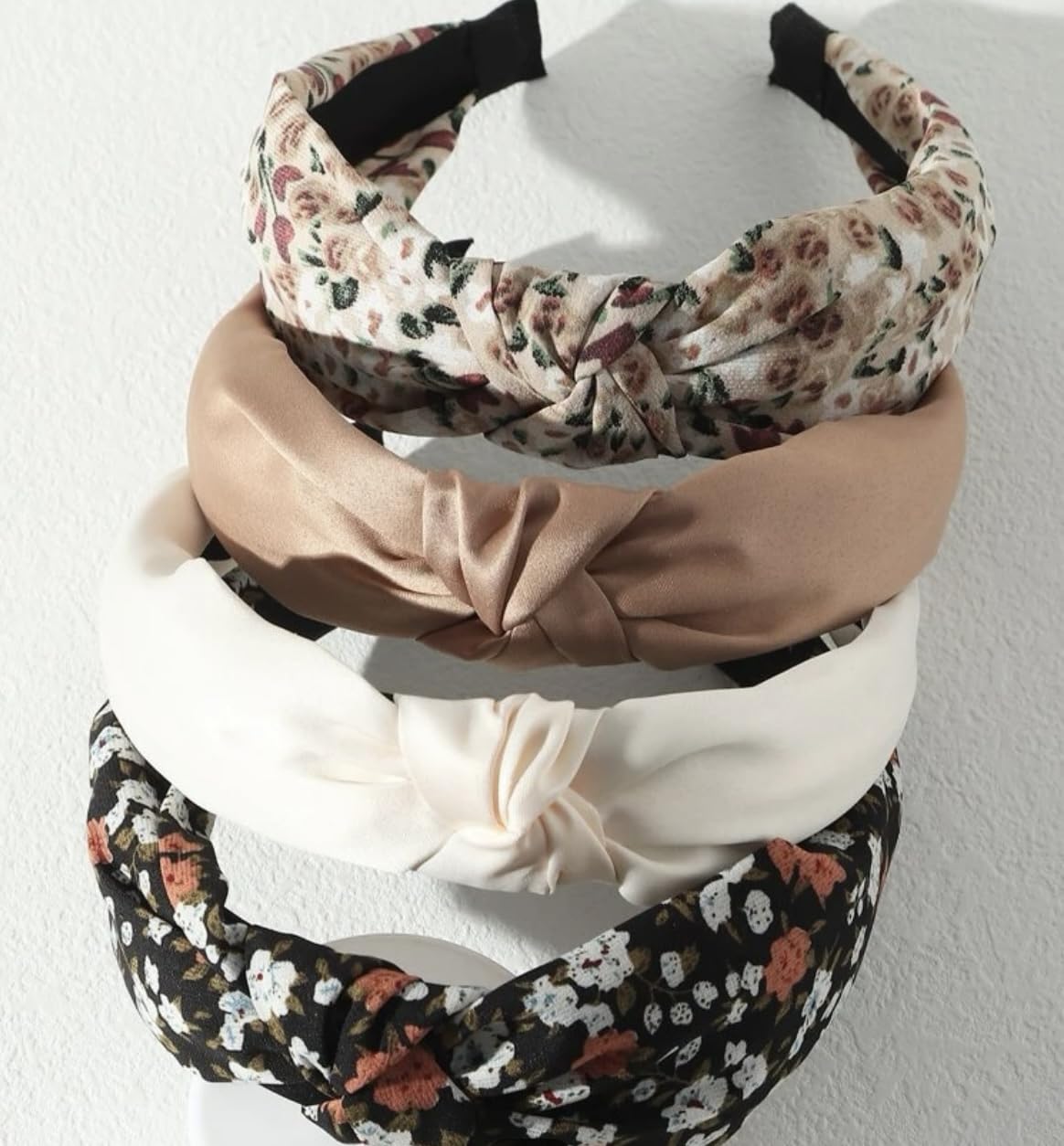 Huachi front view of four headbands showing colors and knot benefit