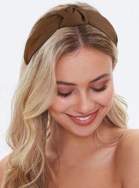 Huachi headband in hand showing size and scale for true-to-fit expectation