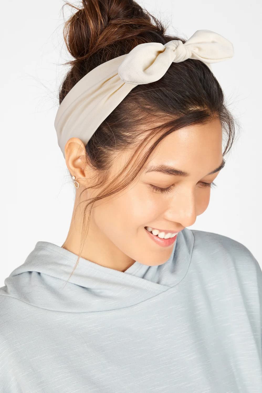 Huachi headband on hand to show size and wearable scale