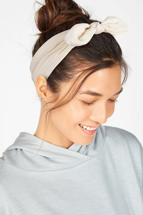 Huachi headband on hand to show size and wearable scale