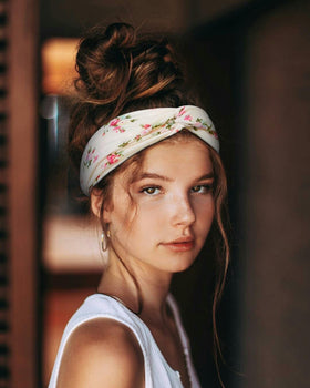 Huachi headband held in hand to show scale and lightweight packability