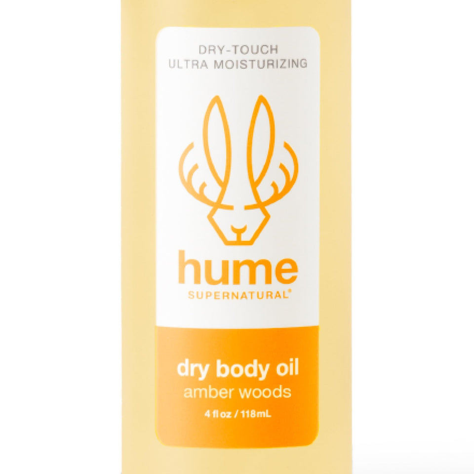 HUME SUPERNATURAL front packaging showing amber woods scent and benefit